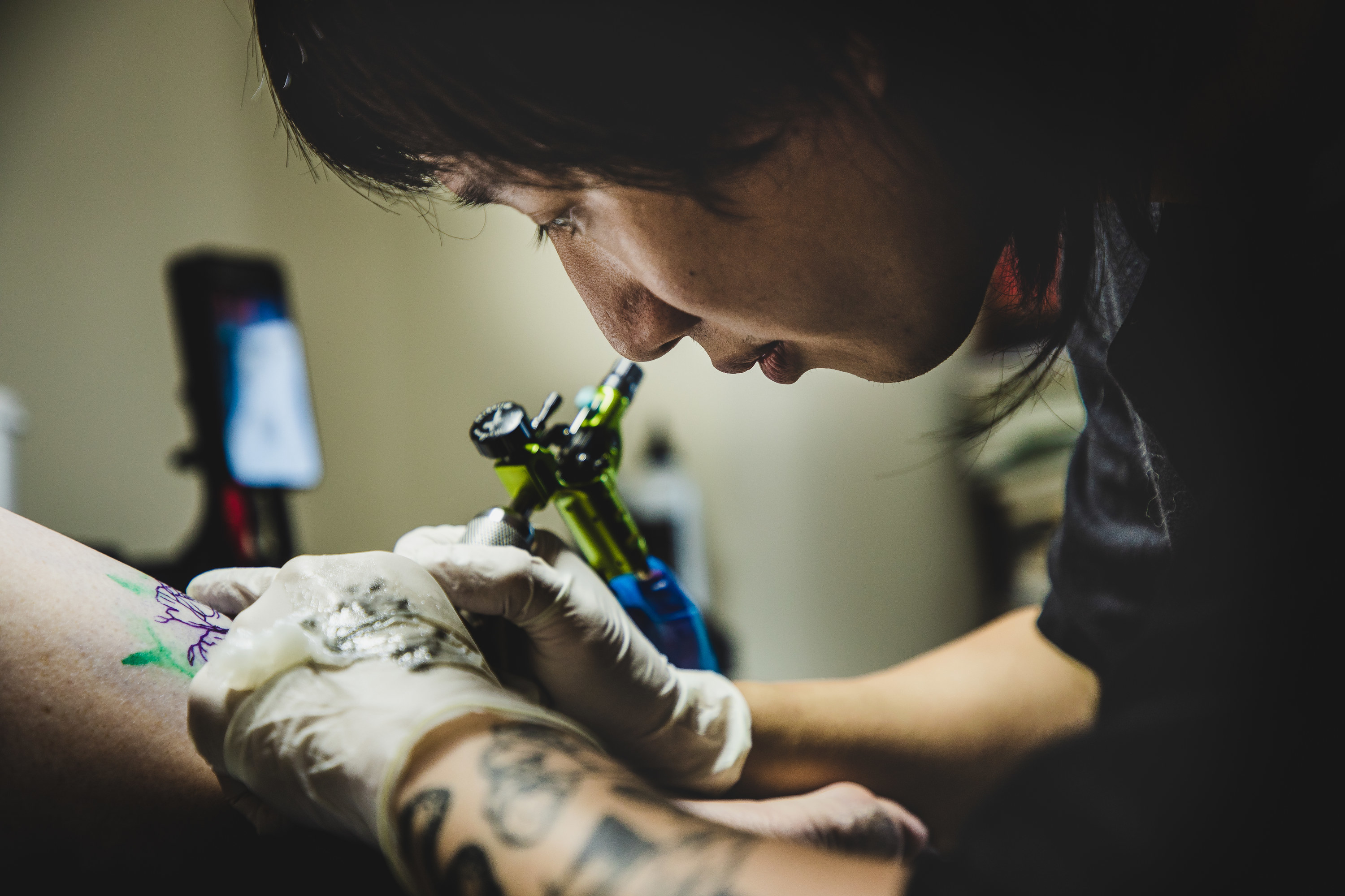 person tattooing
