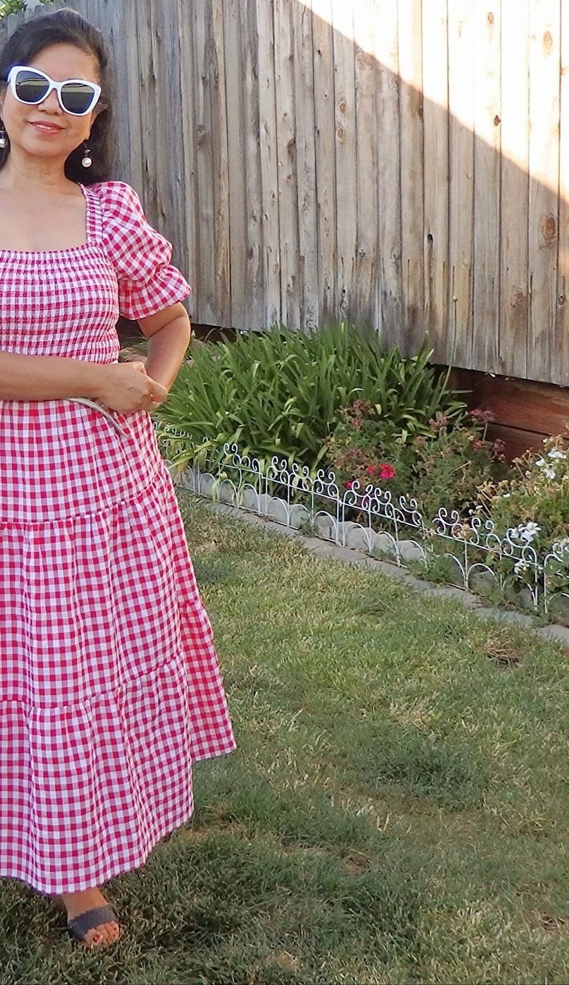 A reviewers in the red plaid dress