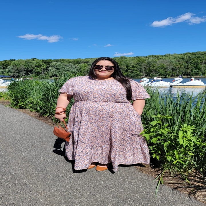 Reviewer wearing the pink dress