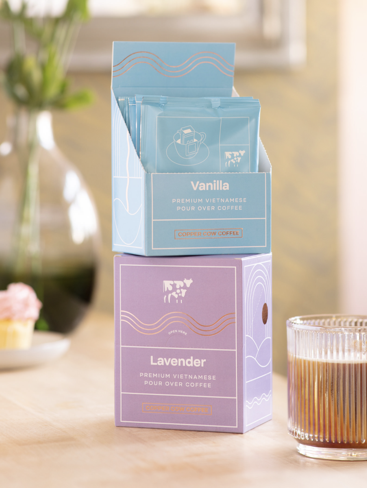 Vanilla and Lavender boxes of pour over coffee on table.