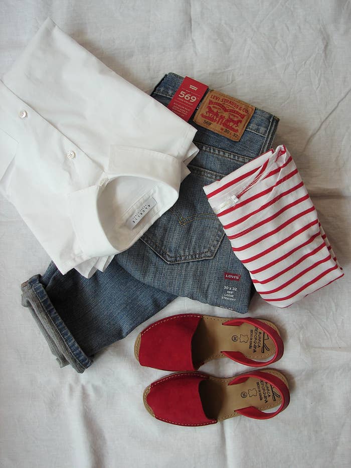 White shirt, blue jeans, red shoes and red striped top