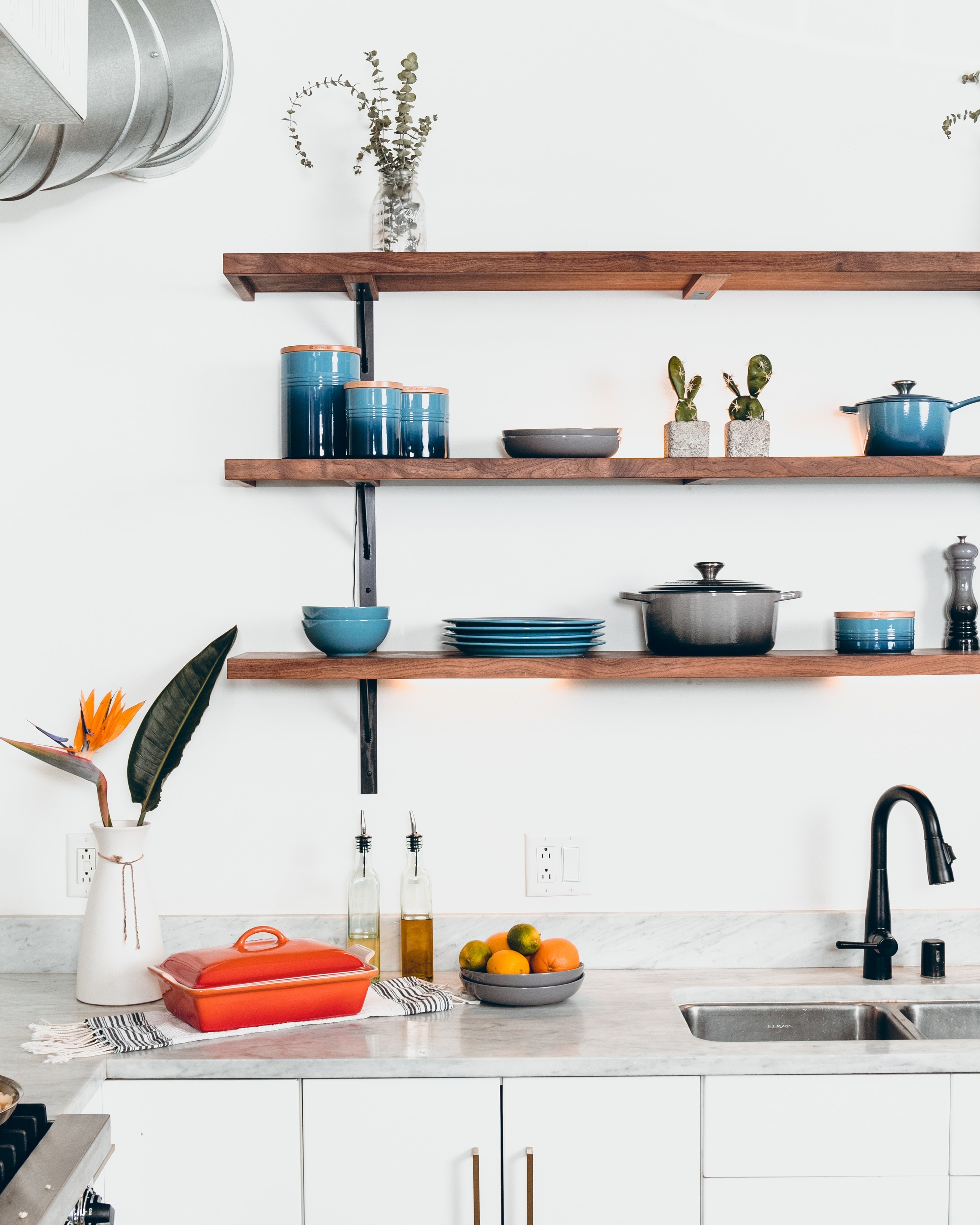 An open kitchen shelving display