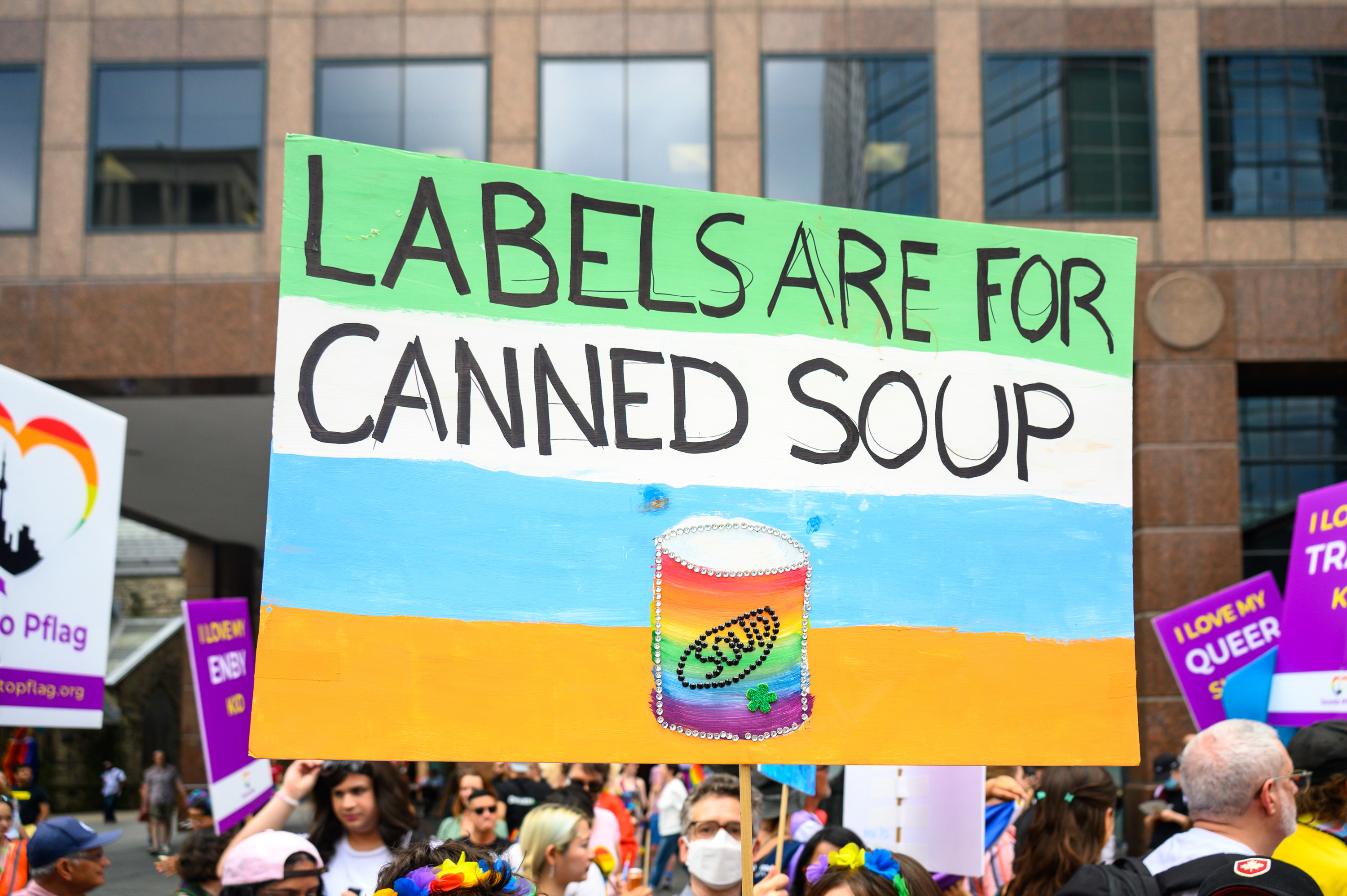 A sign from Toronto Pride that reads &quot;labels are for canned soup&quot;