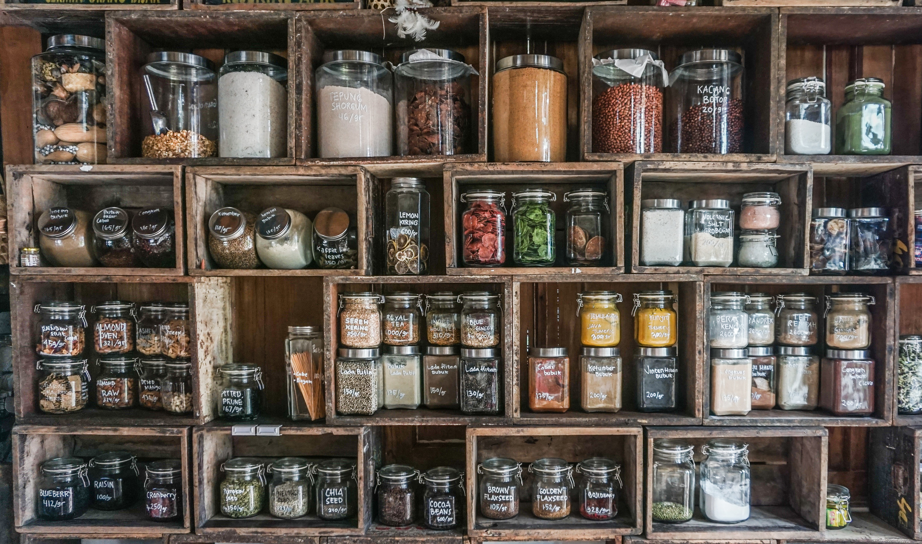 A variety of spices and seasonings on display in open cubbies