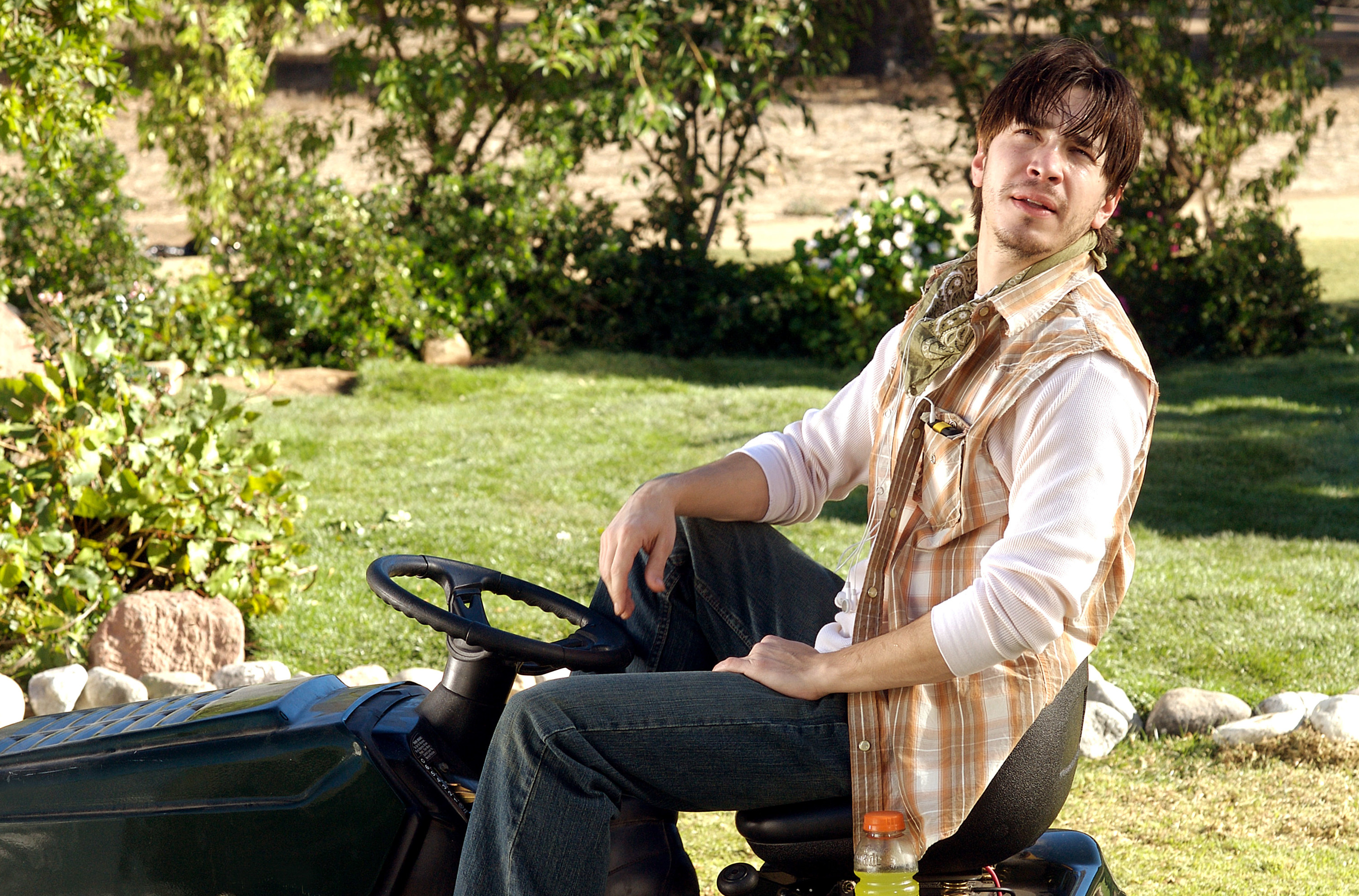 A man mowing his lawn