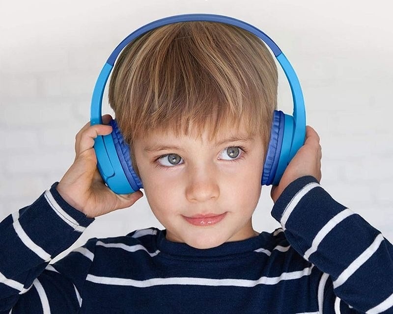 Child wears headphones