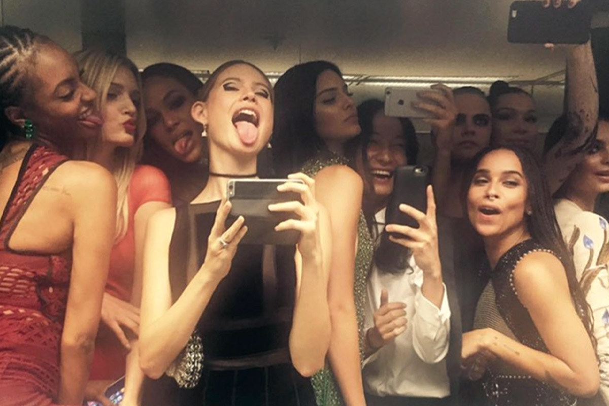A bunch of celebs taking a bathroom selfie