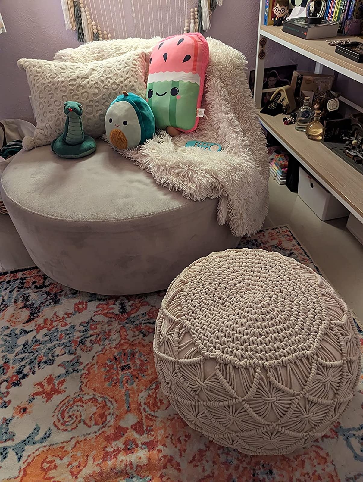 Reviewer image of the pouf next to a chair
