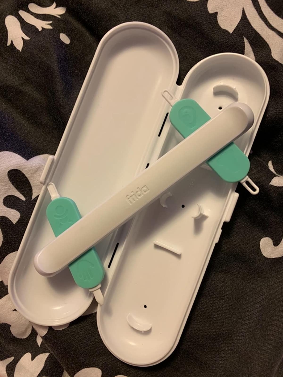 Reviewer&#x27;s photo of white and teal three-in-one picker in white opened case