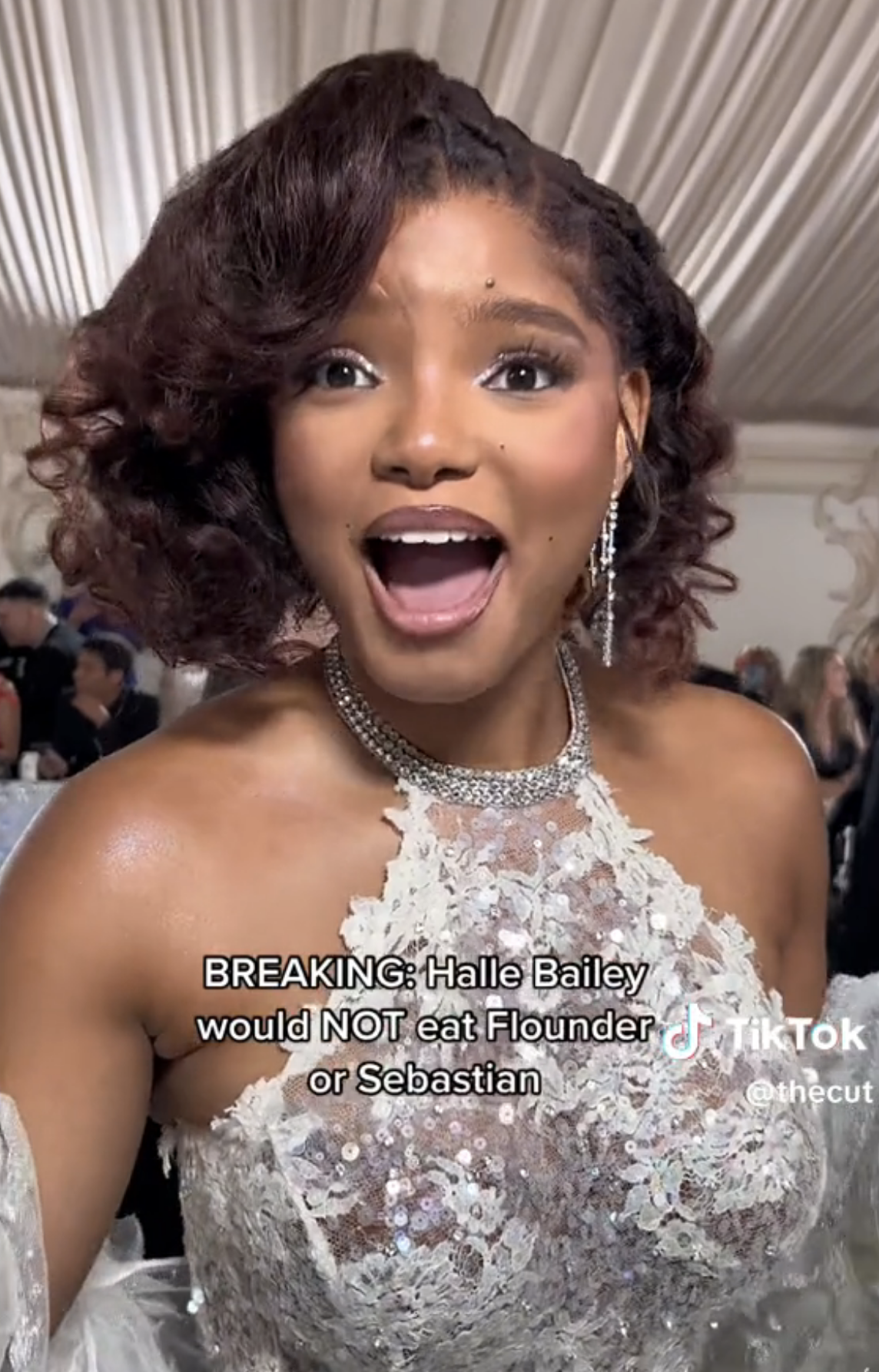 Closeup of Halle Bailey looking shocked