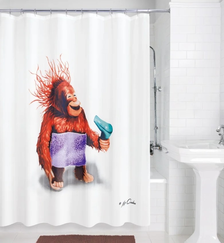 The monkey shower curtain hung in the bathroom