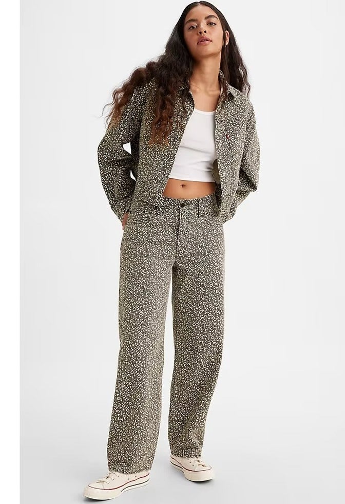 A model in the printed jeans with matching jacket