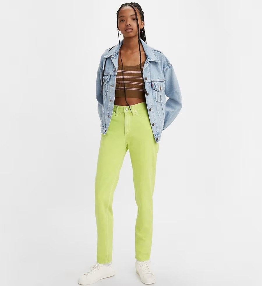 A model in the lime green cropped jeans