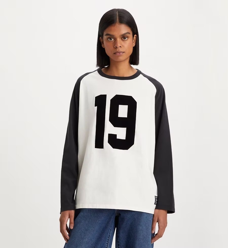 A model in the black and white top with a number nineteen
