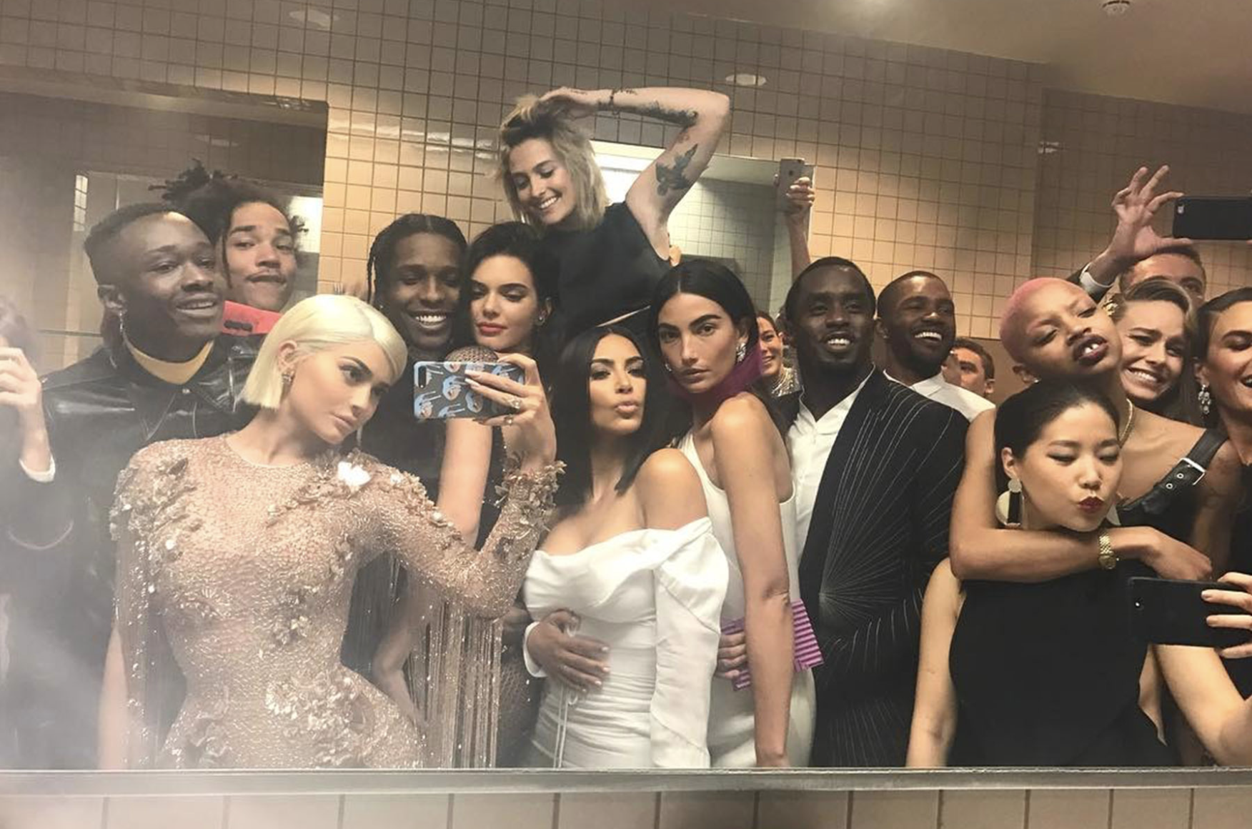 A bunch of celebs, including Kylie Jenner, Kim Kardashian, A$AP Rocky, and Diddy, taking a selfie