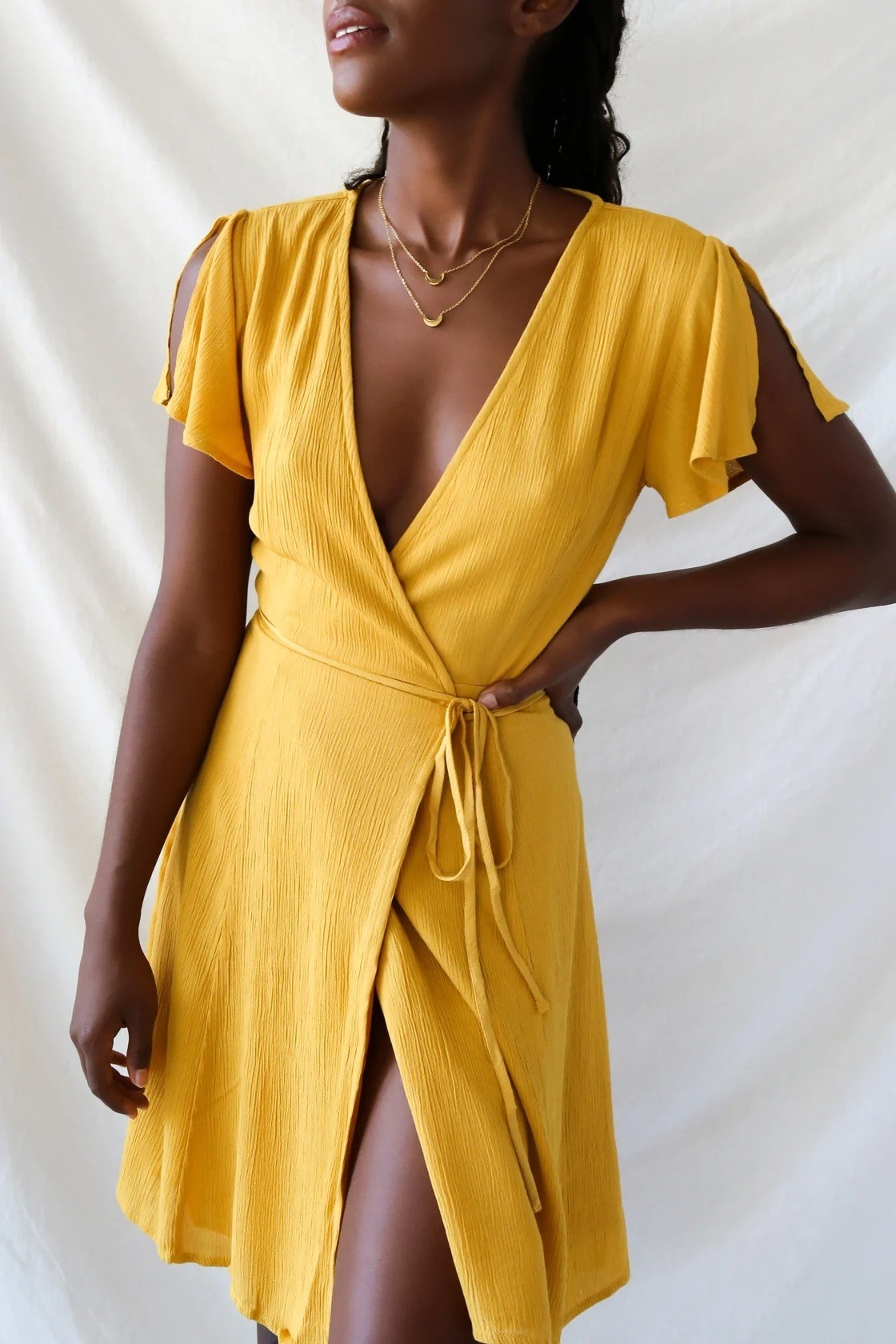 Model wearing the yellow dress