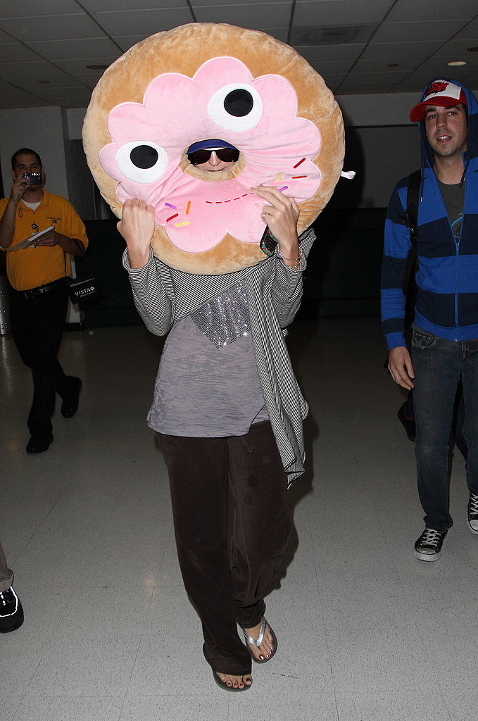 Katy Perry holding a giant donut pillow