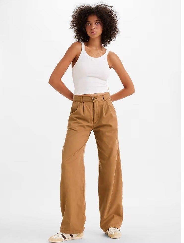 A model in the tan wide leg pants