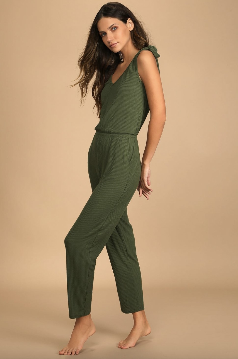 A model wearing the jumpsuit in olive green