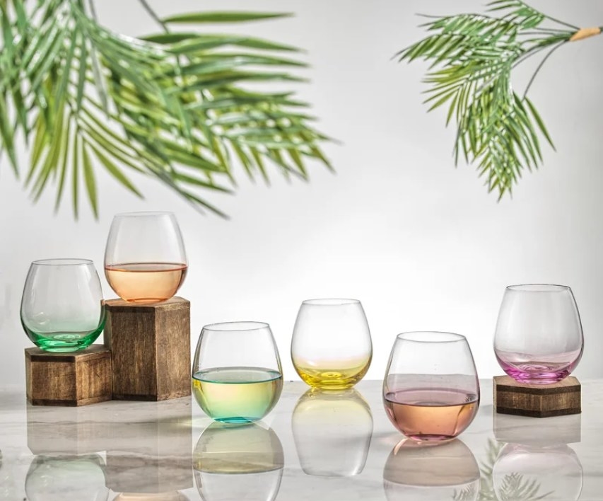 The stemless wine glasses each showing a different color