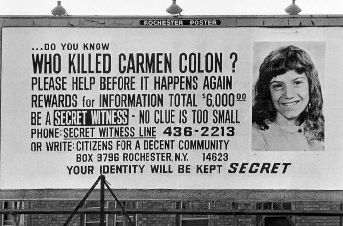 A billboard with a photo of carmen colon asking for information
