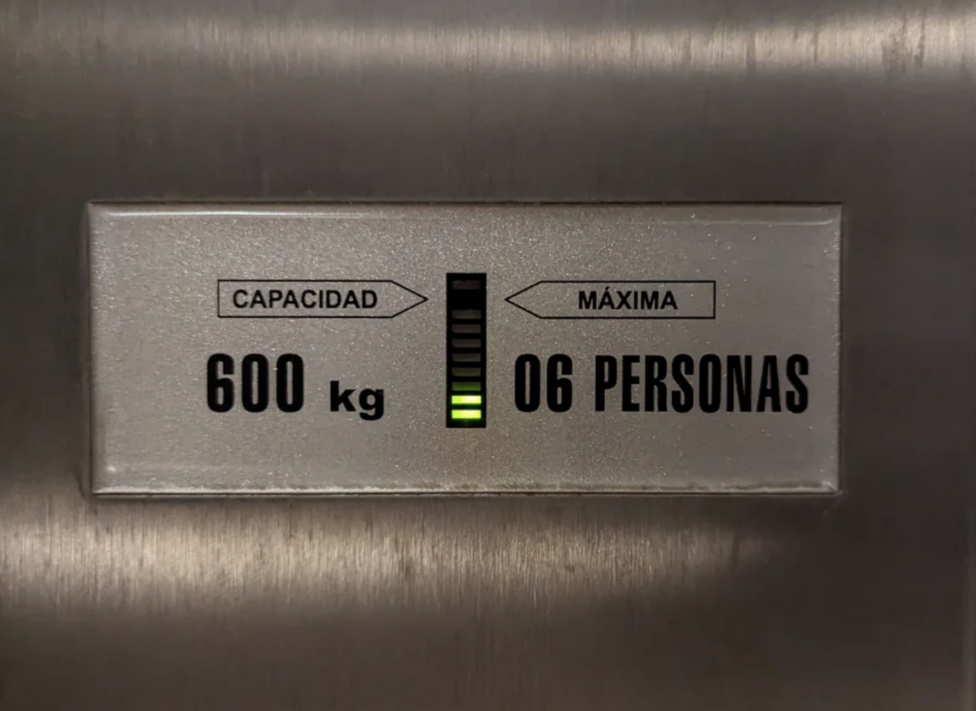 A sensor on an elevator displaying the weight