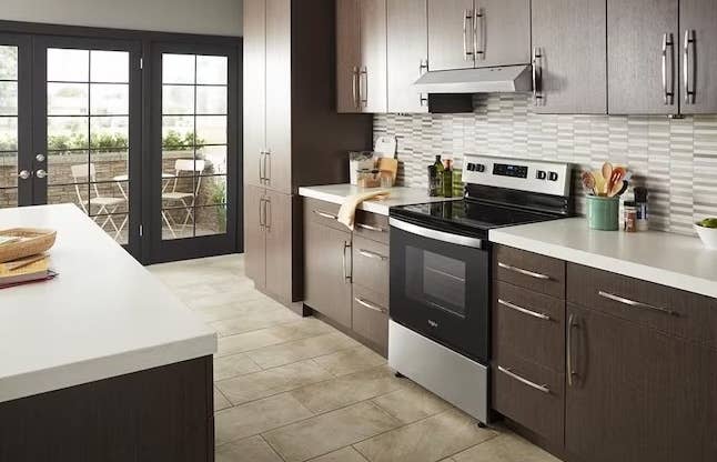 a black and steel oven and stovetop in a kitchen