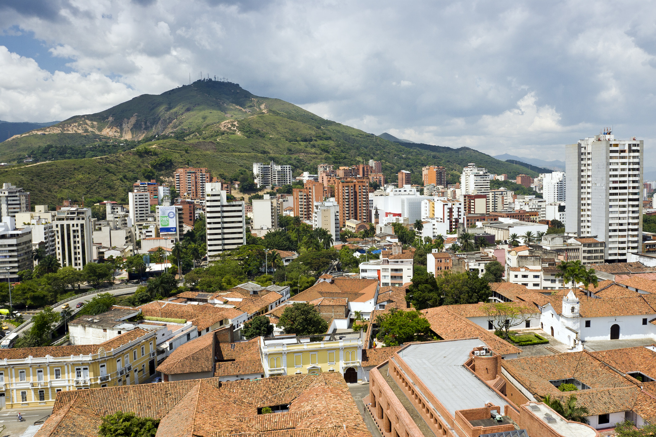 view of cali columbia with many tall buildings and mountains behind