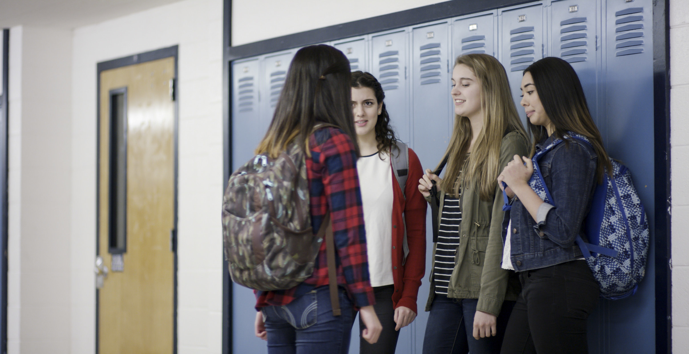High school girls congregating near the lockers