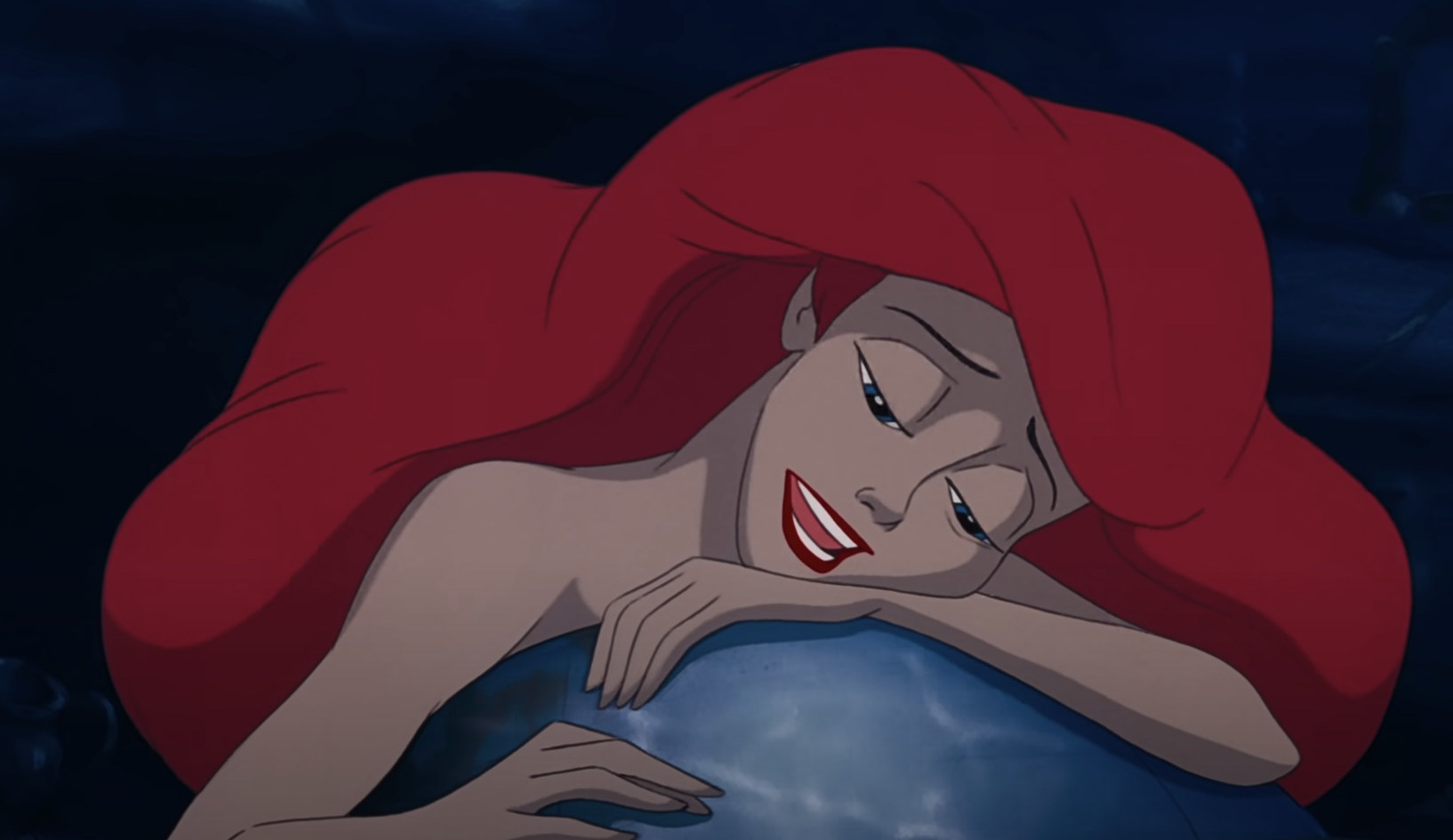 Ariel resting her head on a rock