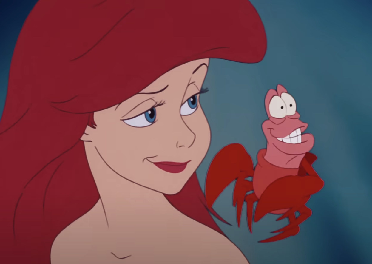 Ariel and Sebastian smiling