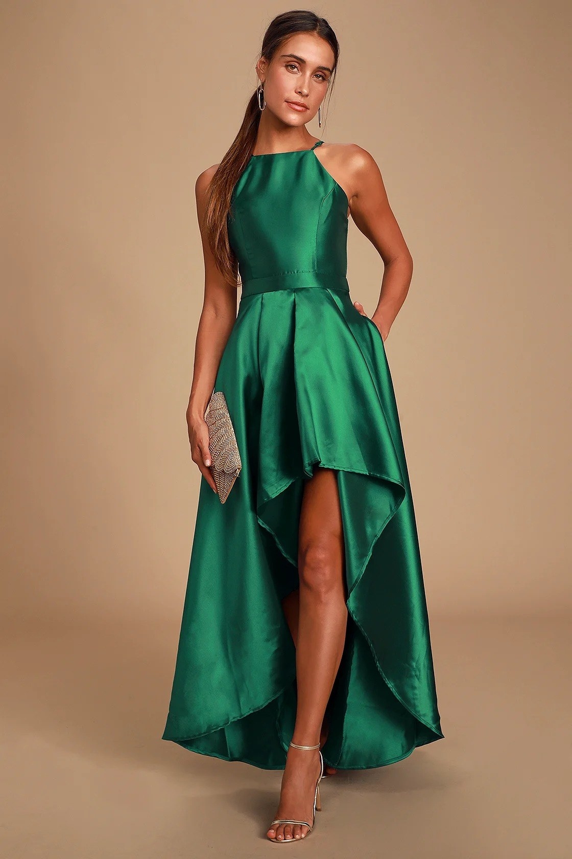 a model wearing the dress in emerald green