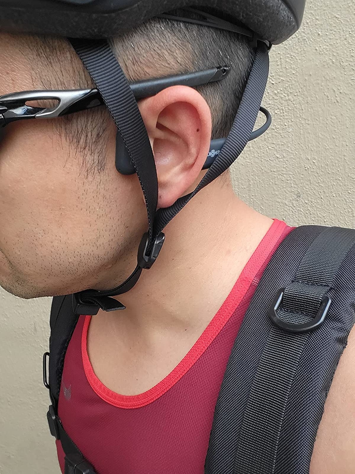 Reviewer wearing the headphones under bike helmet