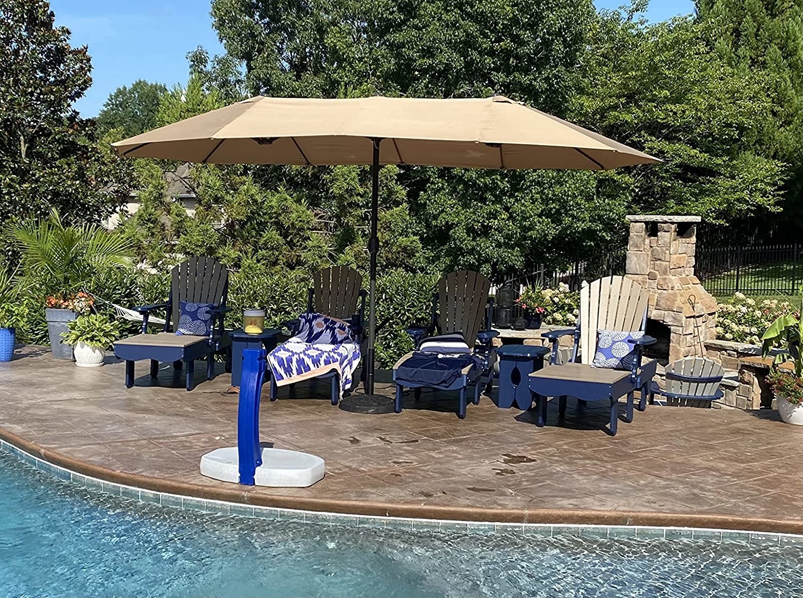 Reviewer&#x27;s photo of huge tan colored patio umbrella