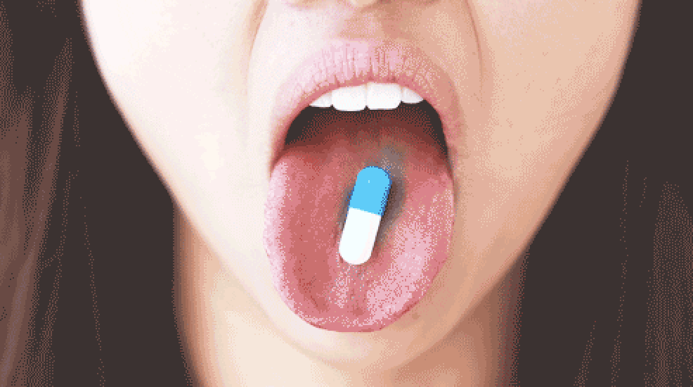 pill on a tongue