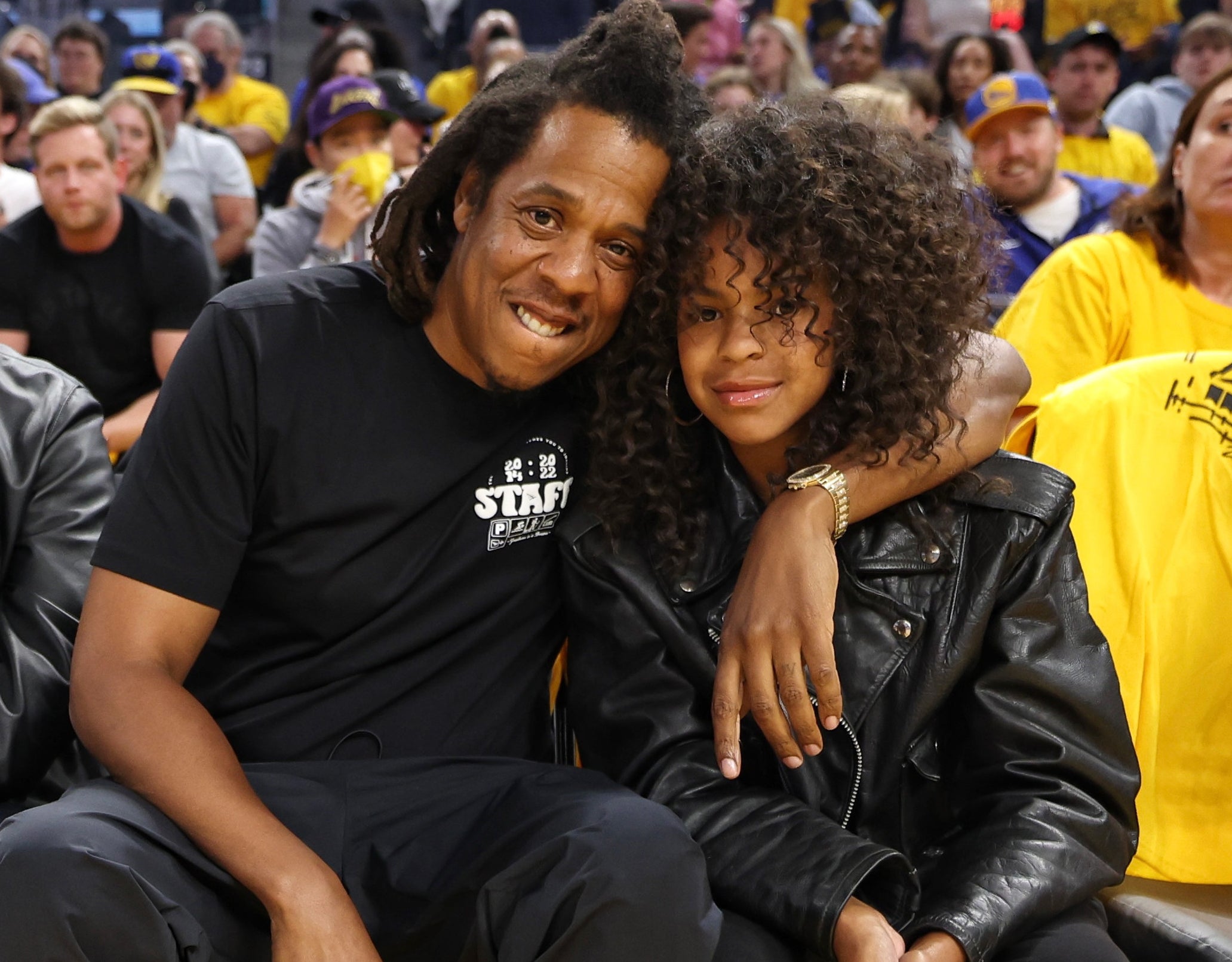 A closeup of Blue and Jay-Z at an event