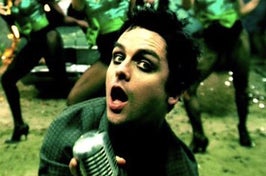 lead singer of green day singing into a mic