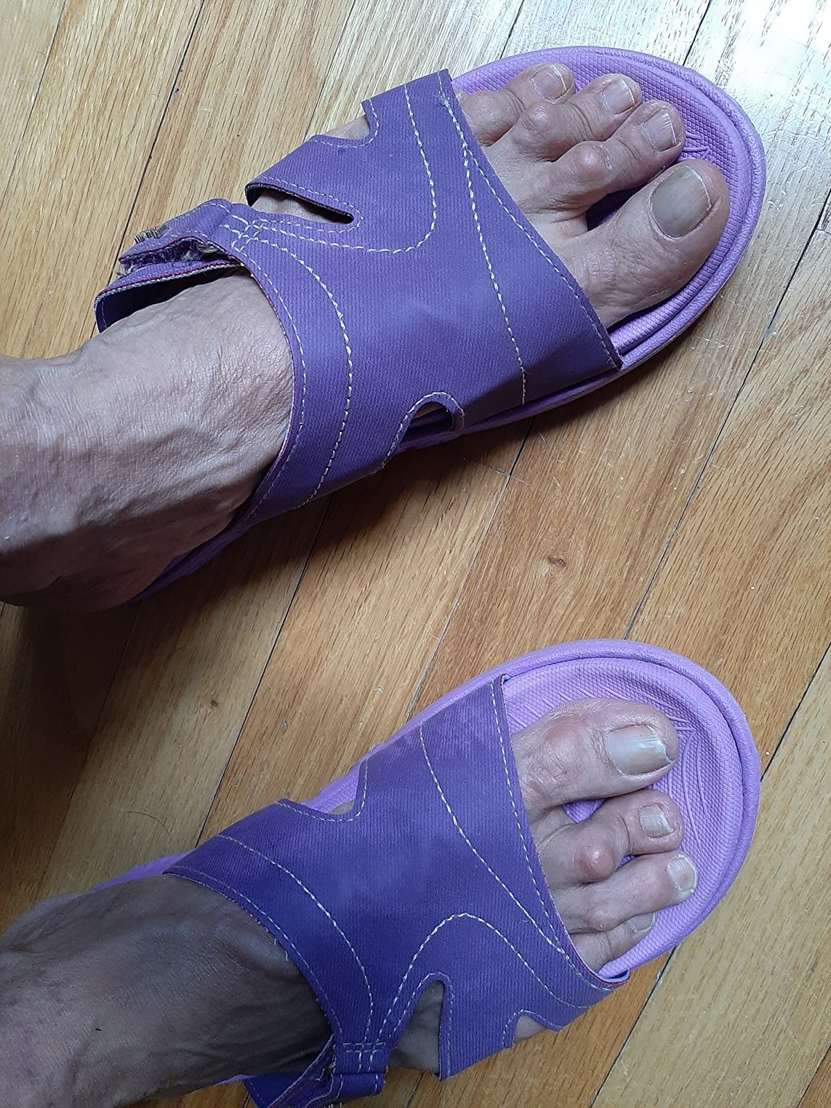 a reviewer wearing a pair of purple shoes