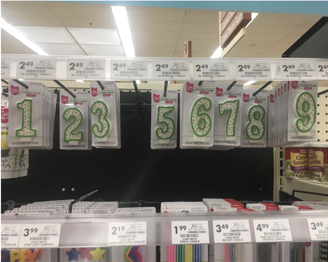 Numbered candles for sale in a grocery store