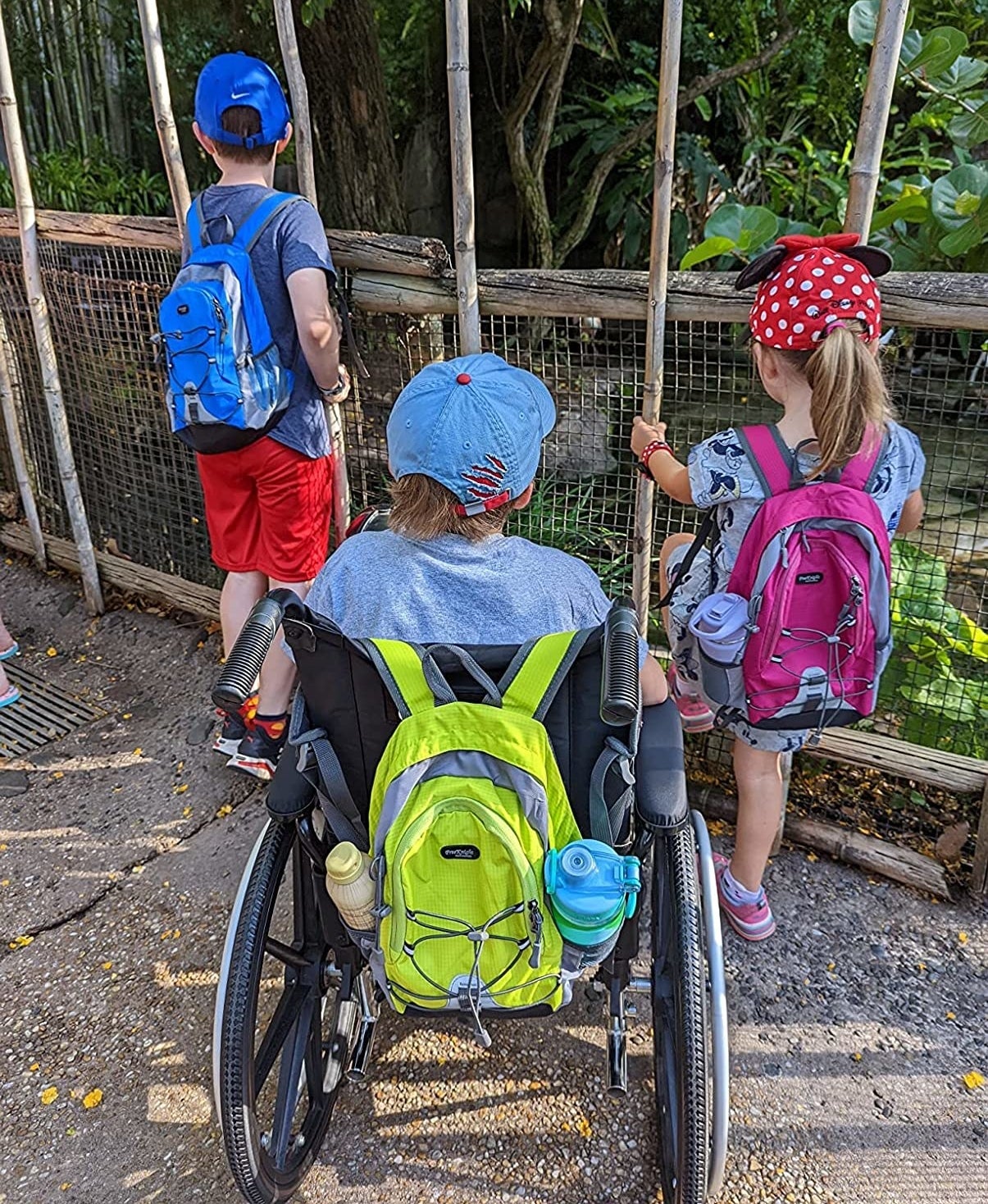 Reviewer&#x27;s image showing three children with colorful backpacks for scale