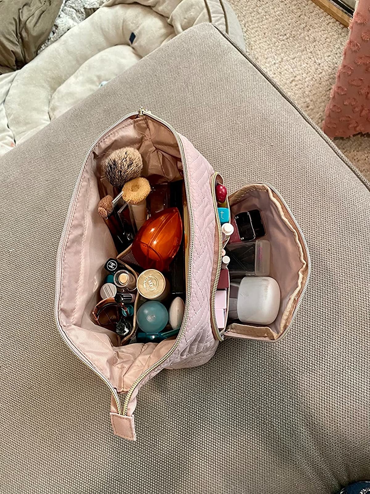 Reviewer image with the makeup bag filled with their makeup