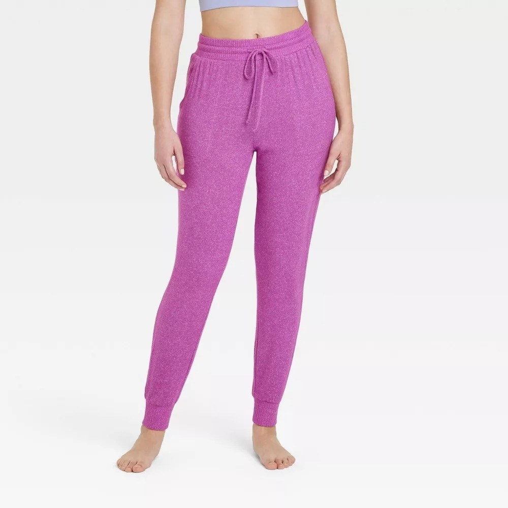 Model wearing purple joggers
