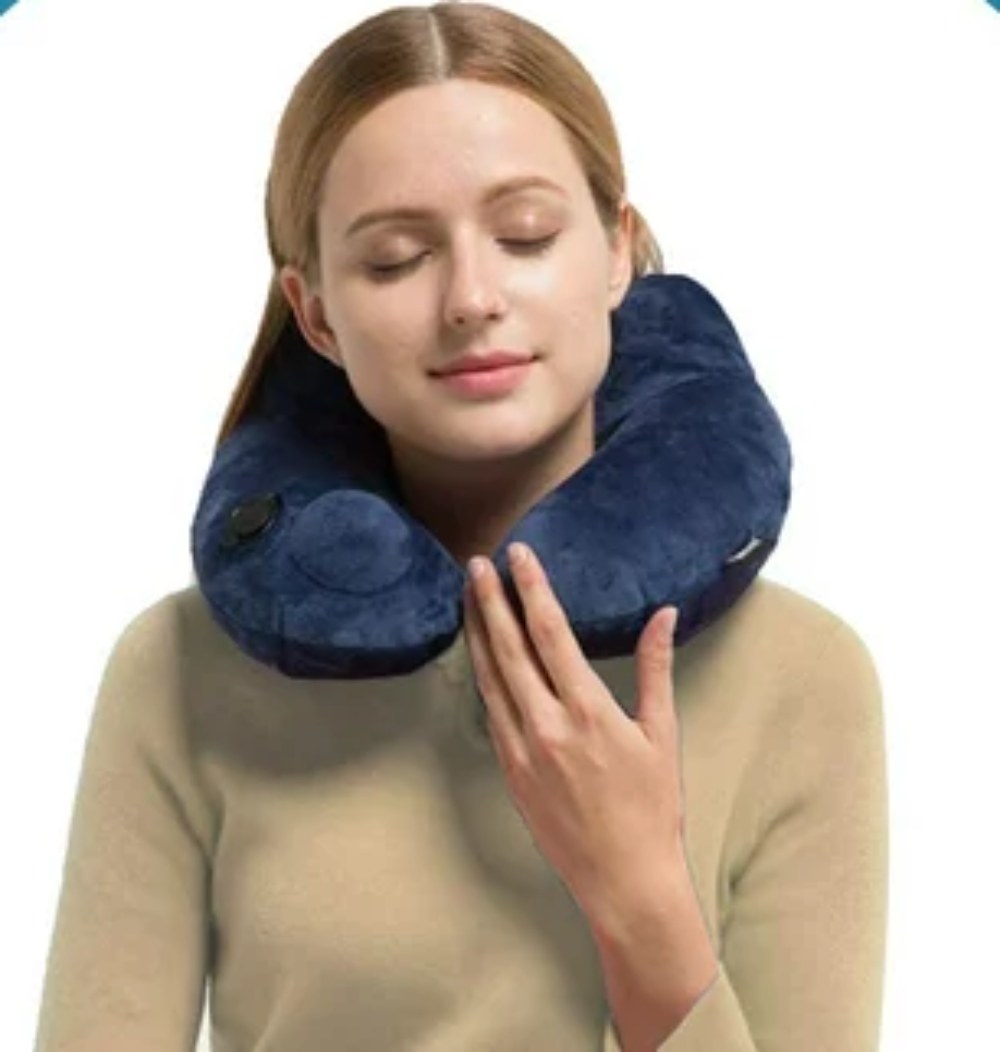 Model wearing inflatable neck pillow