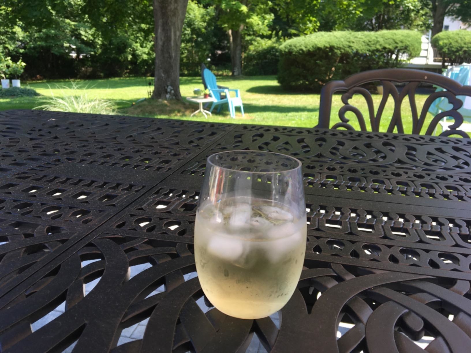 Reviewer photo of a wine glass with wine in it outside