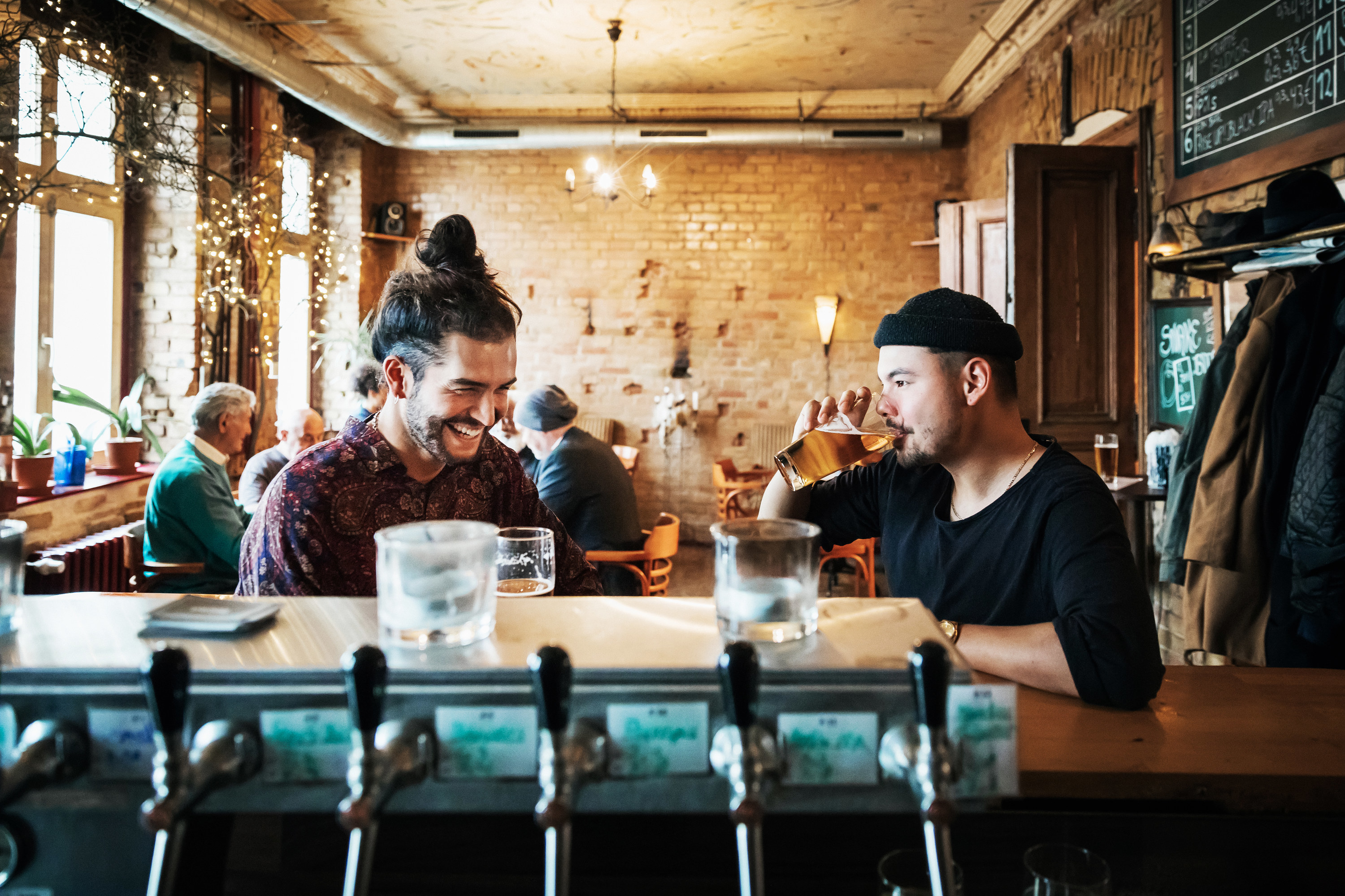 Two people sitting at a bar