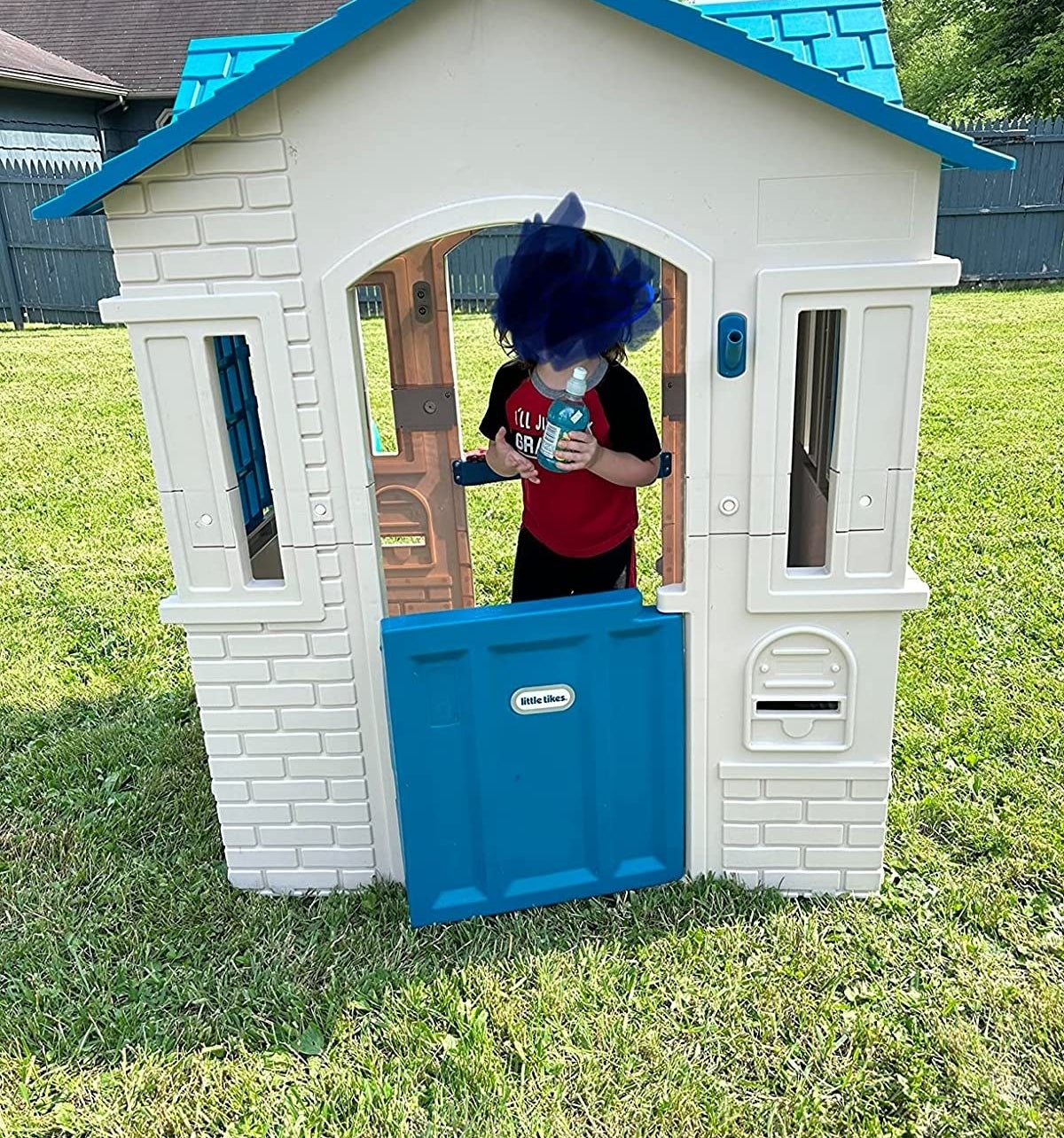 Child inside playhouse