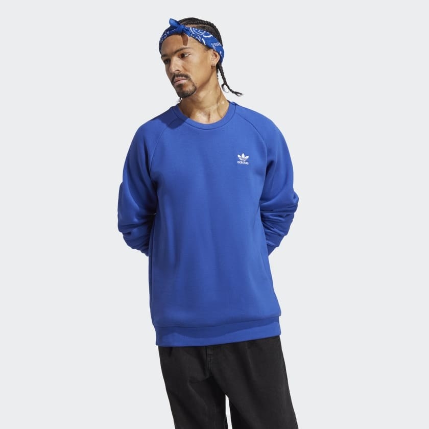 model wearing crewneck sweatshirt in blue
