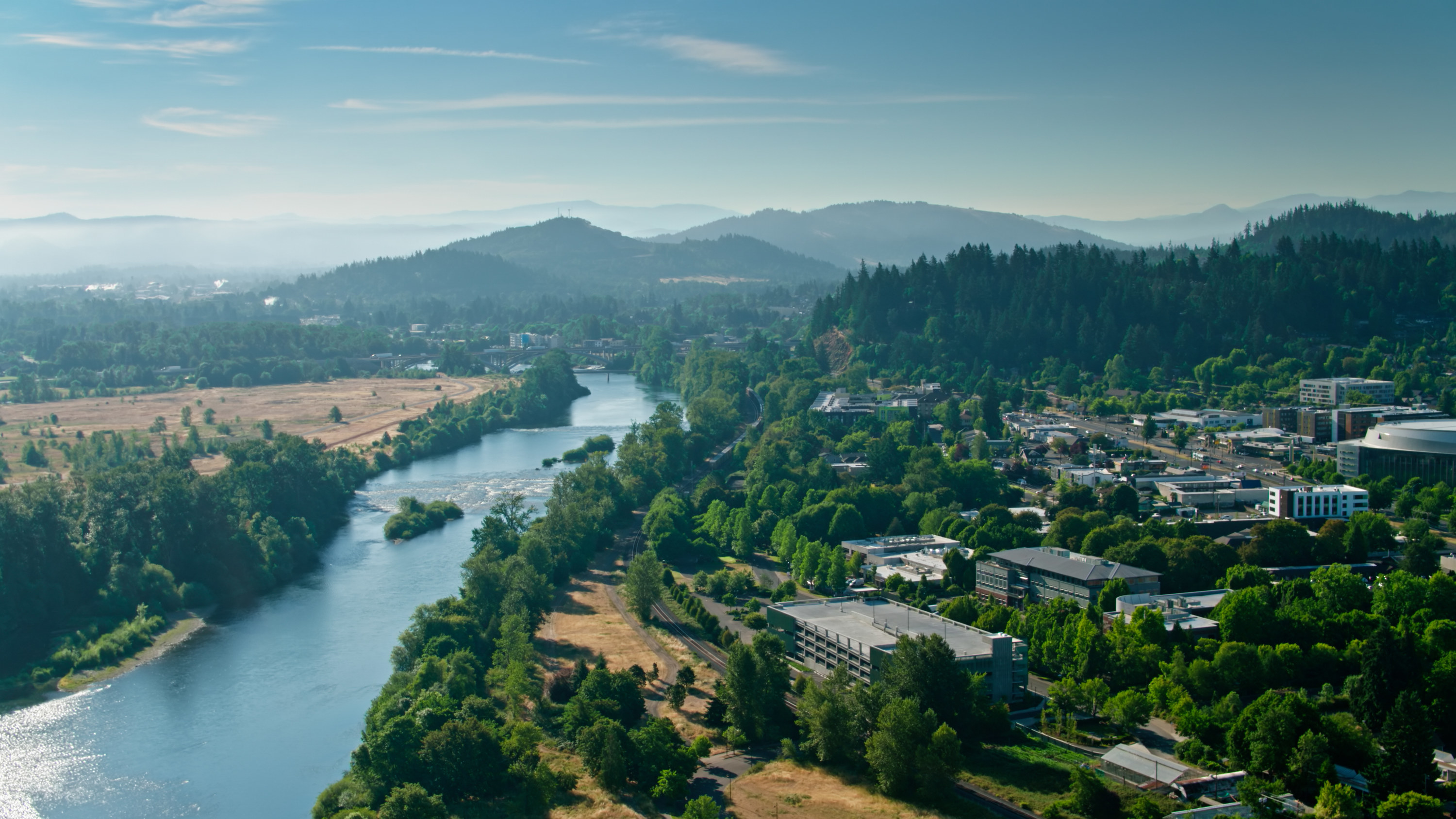 Aerial shot of the Willamette River flowing through Eugene, Oregon.