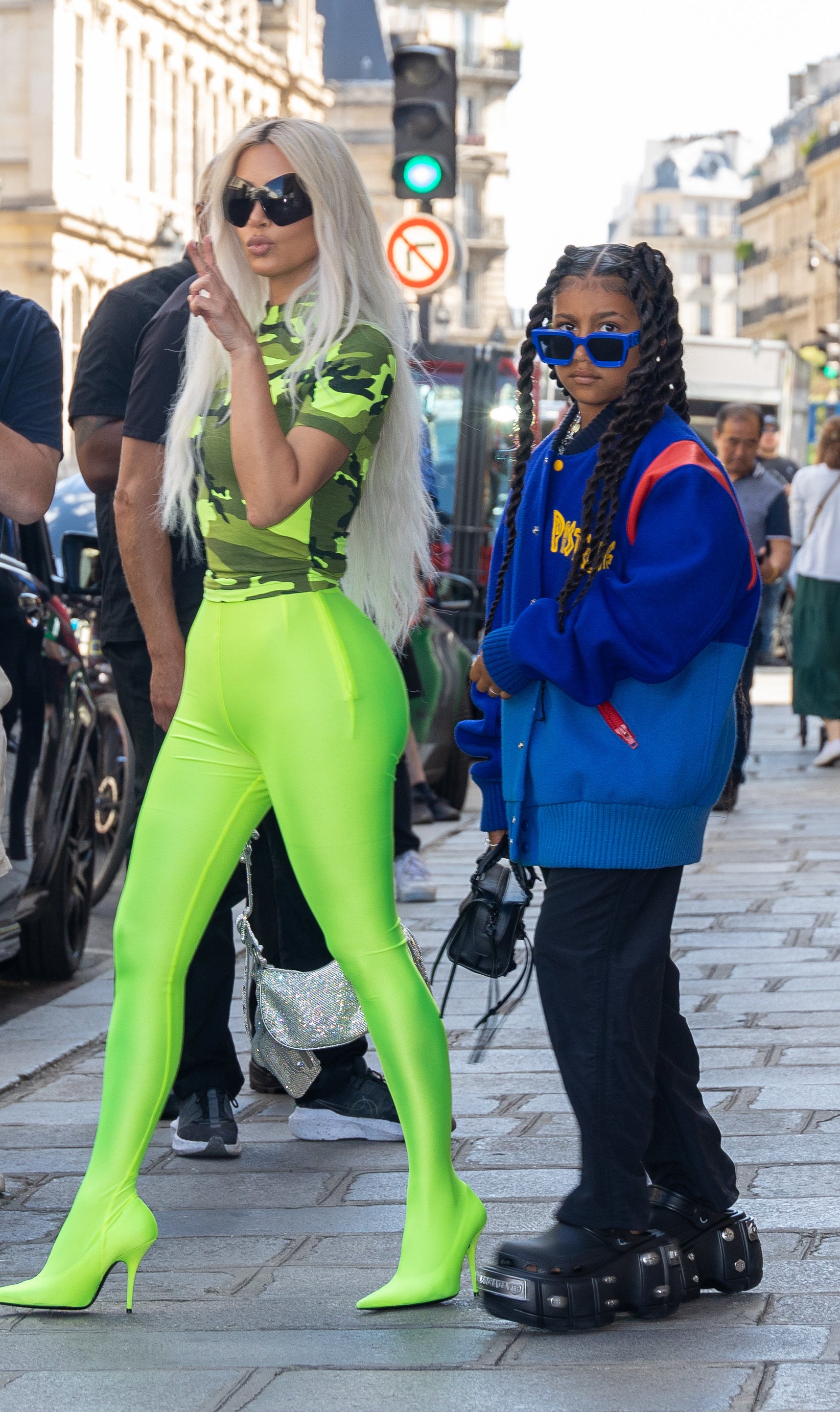 kim and north walking to the car