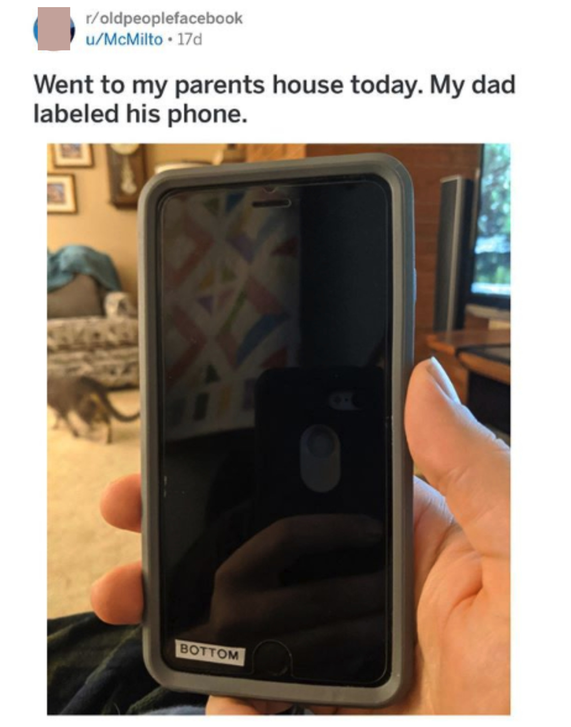 A phone with a printed label indicating the "bottom" of the phone